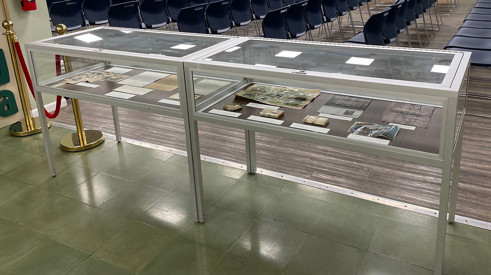 glass cases containing documents and objects