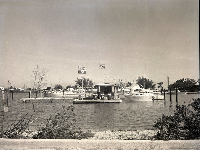 a marina with a fuel dock in the foreground