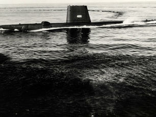 A submarine with the top part visible above the water