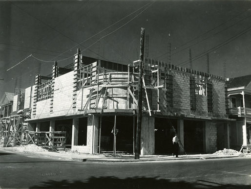 a concrete block building under construction.