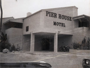A building with Pier House Motel written on the facade.