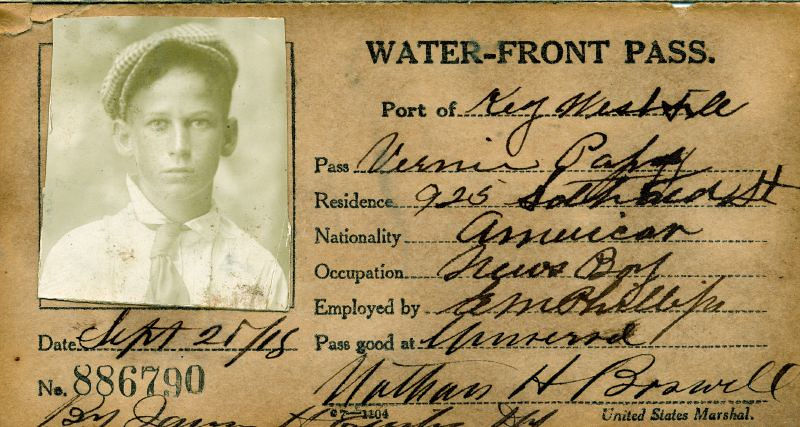 Water-front pass for the port of key west in 1918 with the name and photograph Bernie Papy, occupation News Boy.