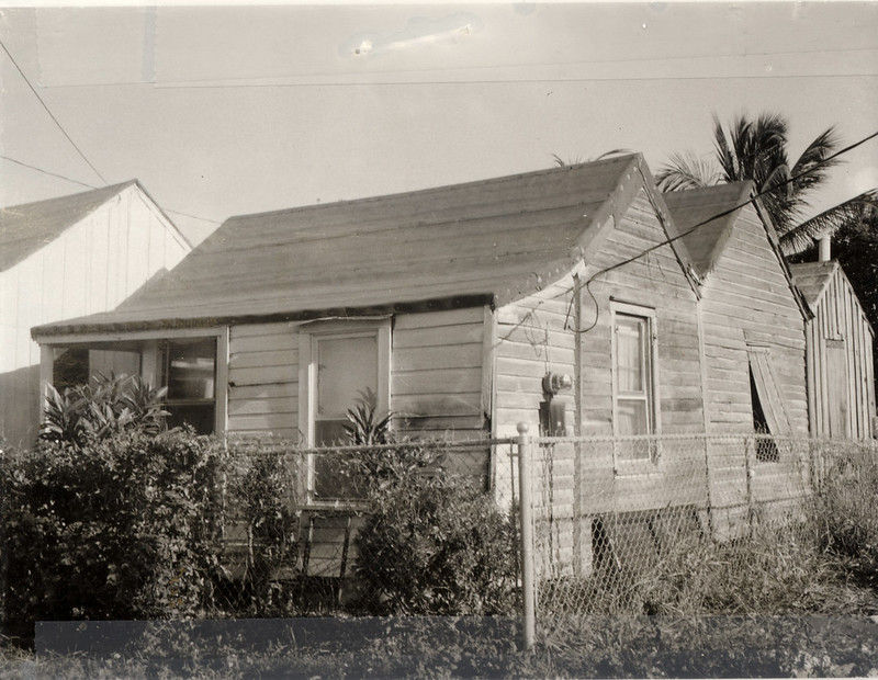 A wooden cottage with several sawtooth additions