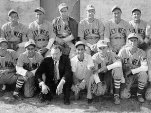 Two rows of men, most of them wearing baseball uniforms with Key West written on the front.