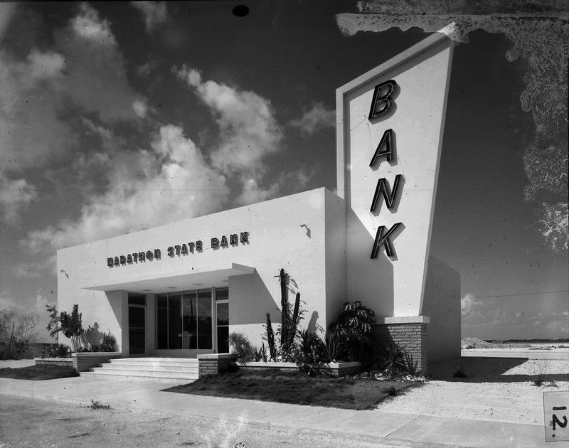 A building with a sign over the door reading Marathon State Bank and a large sign on the side reading Bank