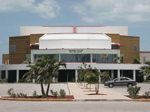 A large building with a sign that reads Tennessee Williams Fine Arts Center