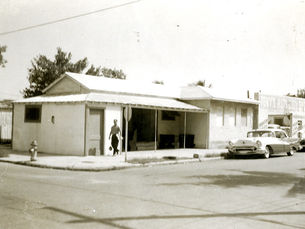 A man walks down a sidewalk