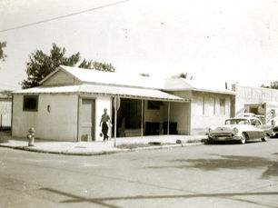 A man walks down a sidewalk