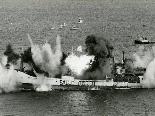 Explosions on a ship with Eagle Tire Co. written on the side