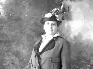 A woman standing next to a chair