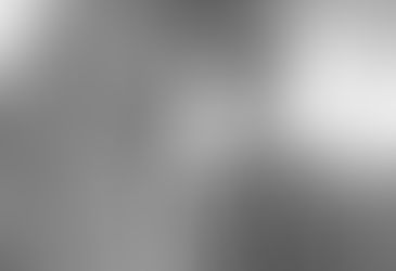 A woman standing next to a chair