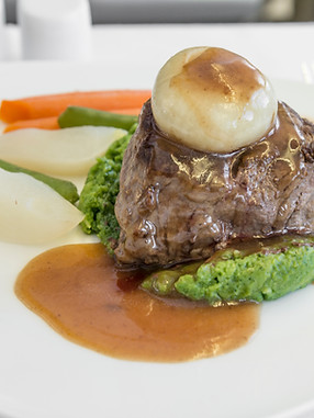 Set inflight meal steak on a tray, on a white table..jpg