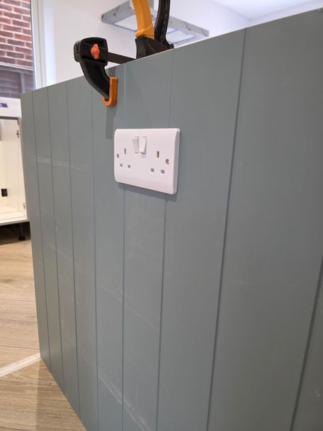 Double socket installed into kitchen island panel