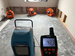 dehumidifier and air movers drying after a water damage