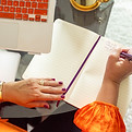 Woman writing in a journal.jpg
