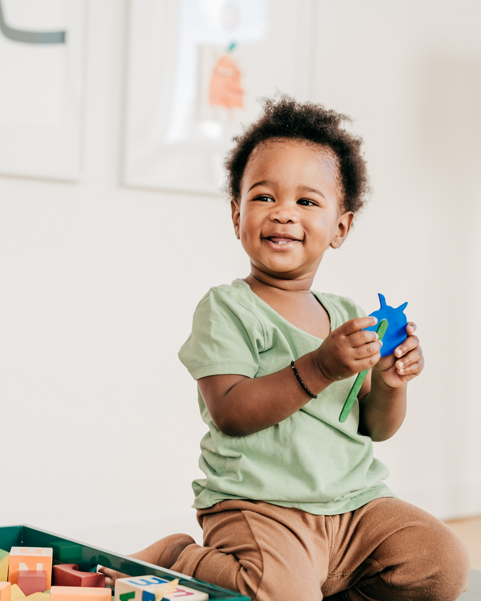 Smiling toddler showing progress in IEP