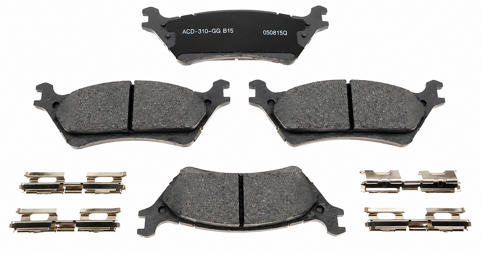 Studio photography of a set of automotive brake pads arranged against a clean white background. The shot is clear and technical, emphasizing the product details and markings.