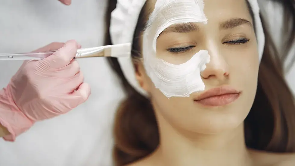 lady get a facial by an aesthetician