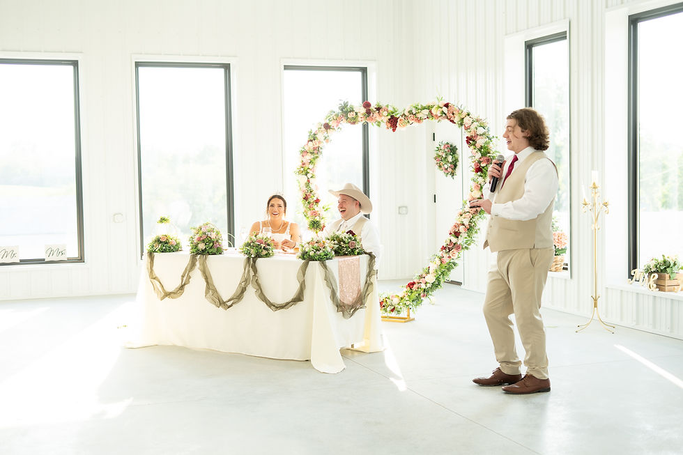 Happy newly married couple at head table