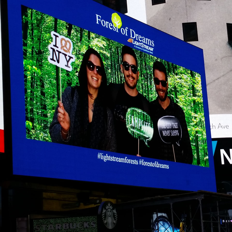 Photo booth photo projected on digital screen in Times Square
