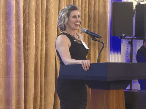 Christina speaking at an event.