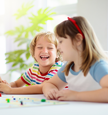 Family playing board game. Kids play
