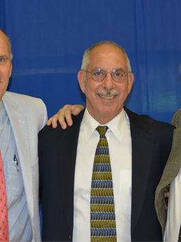Hyde School alumnus Albert Ancel ’72 receiving his diploma from Joe Gauld in 2013, celebrating resilience and lifelong growth.