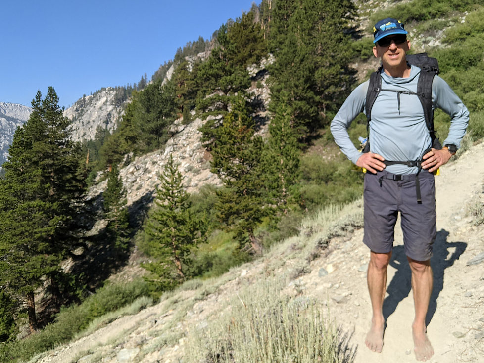 Barefoot Ken hiking barefoot in the mountains