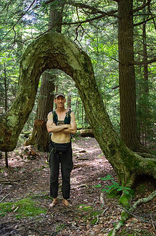 Barefoot Ken, standing barefoot and shirtless, in the Catskill Mountains