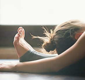 Young%20woman%20practicing%20yoga%2C%20sitting%20in%20Seated%20forward%20bend%20exercise%2