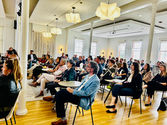 Audience listening to a keynote