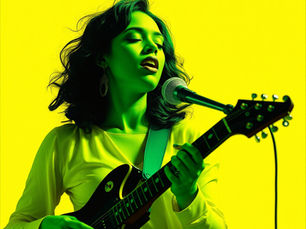 Singer with a guitar performs passionately with eyes closed. Bright yellow background, green lighting creates a vibrant mood.