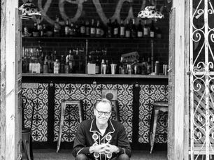 Ben Bell sits outside a beloved Baton Rouge venue, ready to share his Western Rockabilly sound, a style all his own that adds a distinct voice to the local live music scene. (Photo courtesy of Ben Bell)