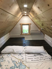 griffith 12x14 with front porch interior of loft looking to rear.jpeg