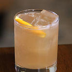 Combine all ingredients, except Ginger beer, in a cocktail shaker with ice and shake.  Strain into a ice filled rocks glass, splash with Ginger beer.  Garnish with the orange twist. 