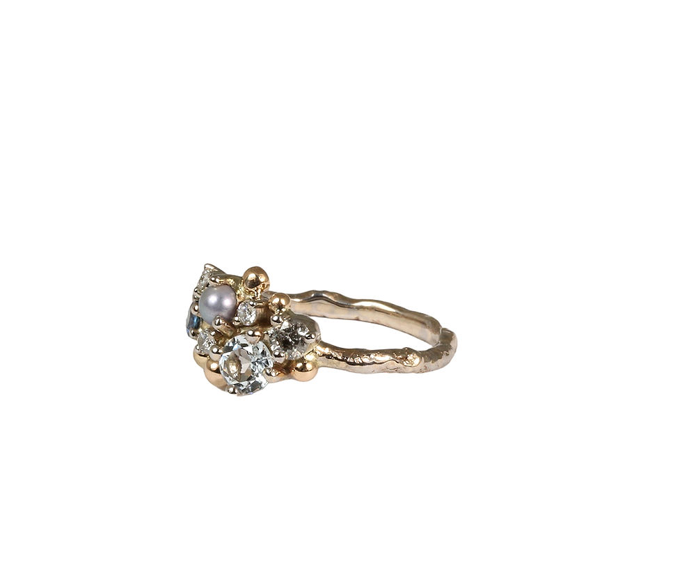 Thumbnail: Artistic gold ring with various gemstones