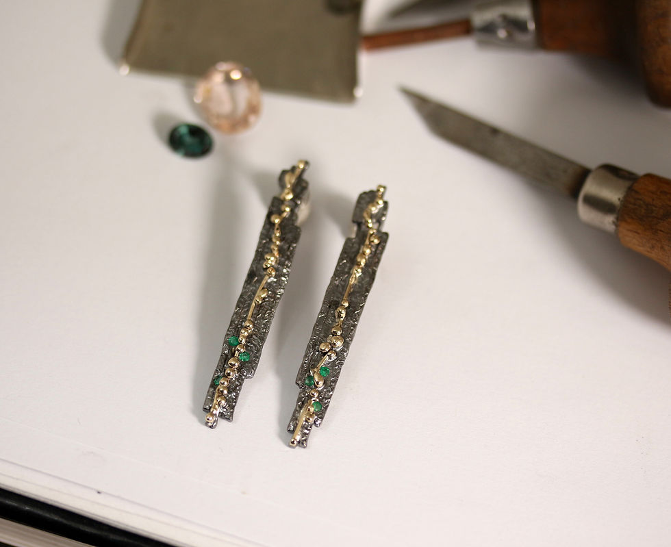 Thumbnail: Unique drop earrings with Emeralds