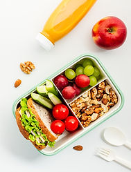 Healthy lunchbox with fresh sandwich, fruits and nuts. Ideal for nutrition blogs and welln