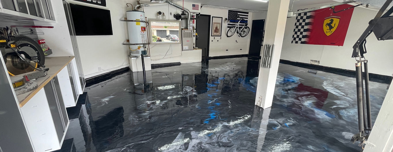 Clean garage with blue and gray epoxy flooring