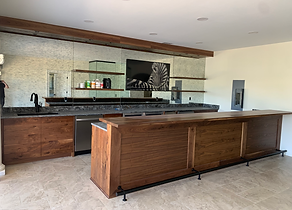 Custom finished basement with a bar