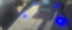 Interior of a hearse fleet vehicle with blue accent lighting.