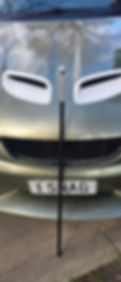 Front of a vehicle with license plate 1 SNAG.