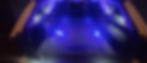 Interior of a hearse fleet vehicle with blue lighting.