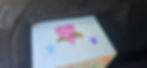 Small white casket with heart and star drawings in a hearse