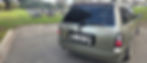 Silver station wagon in a cemetery with I SNAG license plate