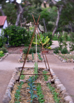 Custom gardens with stone boarders.