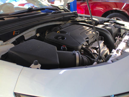 the engine bay of a white sedan