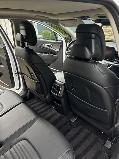 Clean car interior, black leather seats, car detailing, ready for interior car cleaning services.