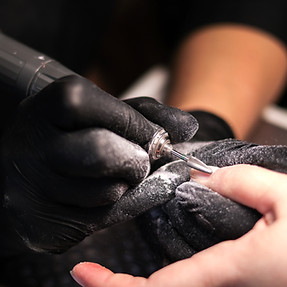 a person cutting another persons hair with scissors_edited.jpg