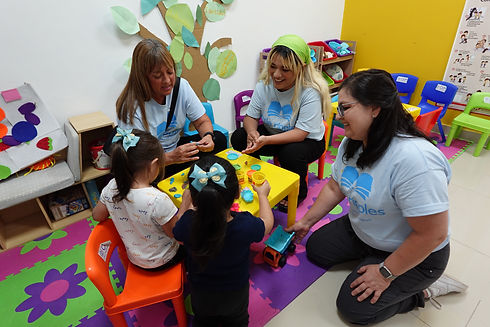 Little Ripples staff playing with children in a preschool iACT
